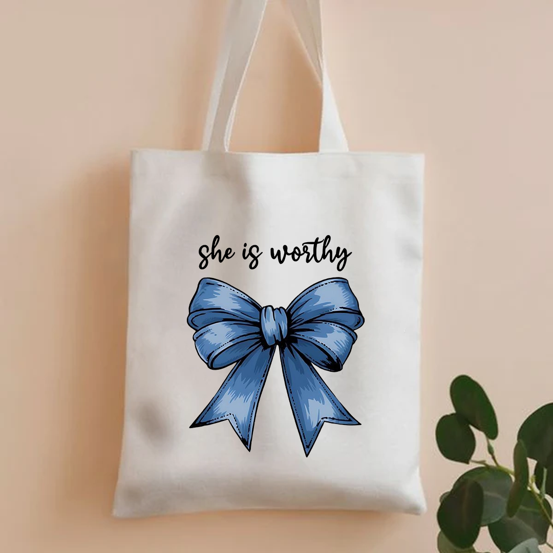 She is worthy tote bag