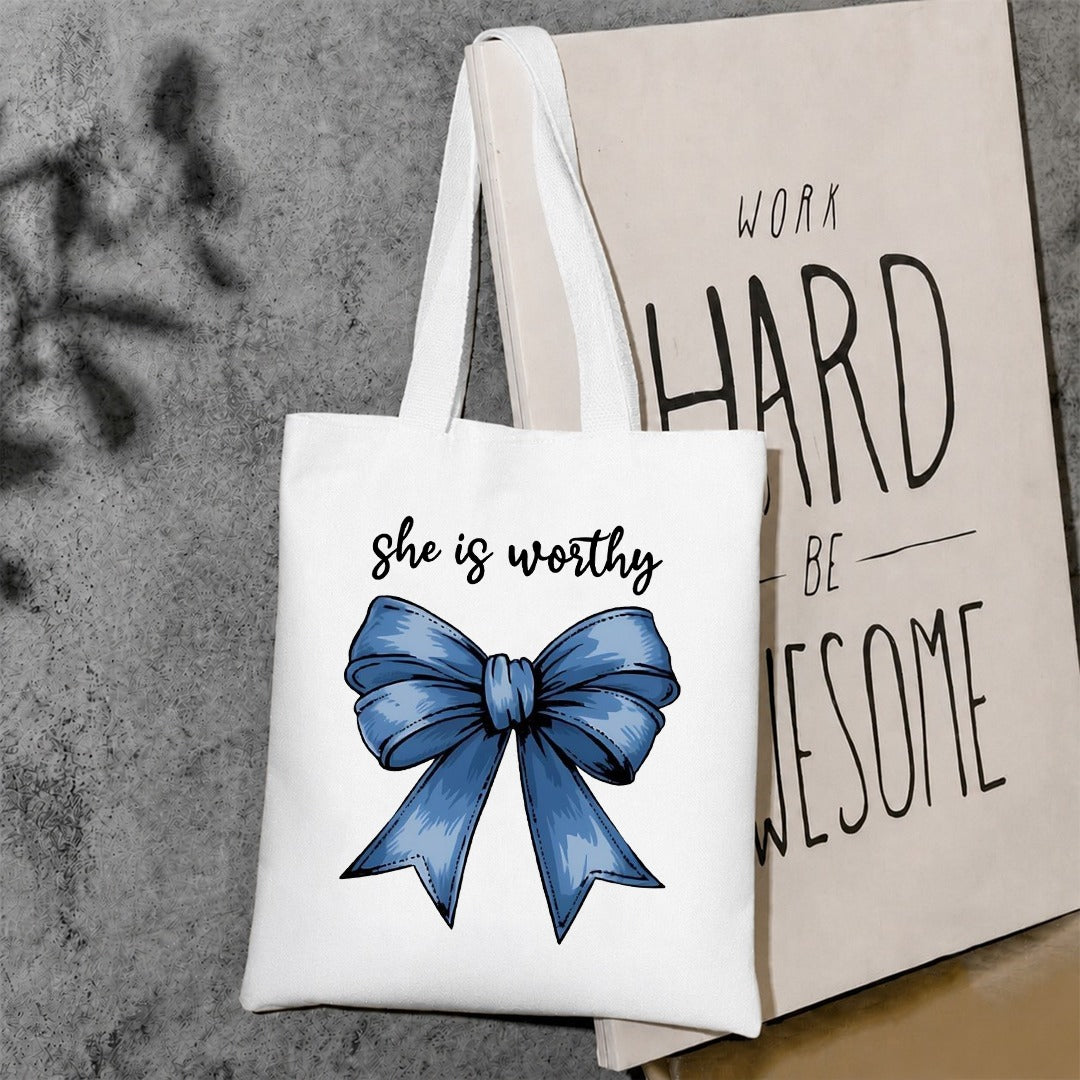 She is worthy tote bag