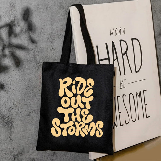 Ride out the storms tote bag