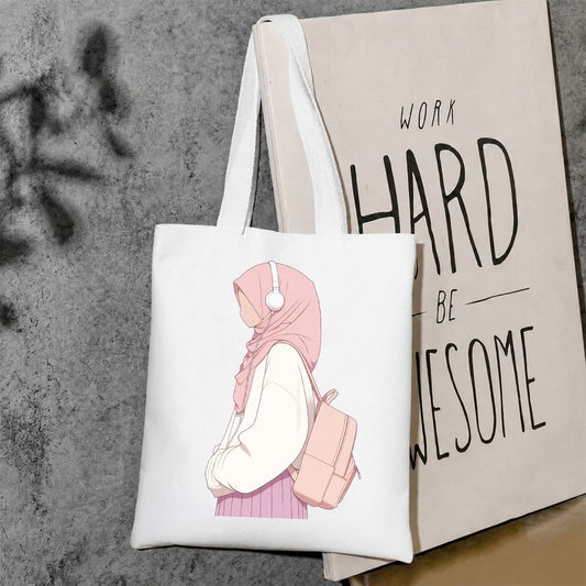 Pink hijab girl wearing headphones tote bag