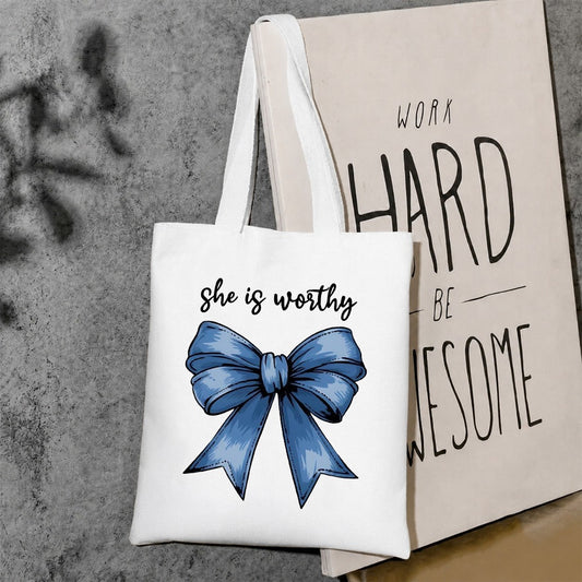 She is worthy tote bag
